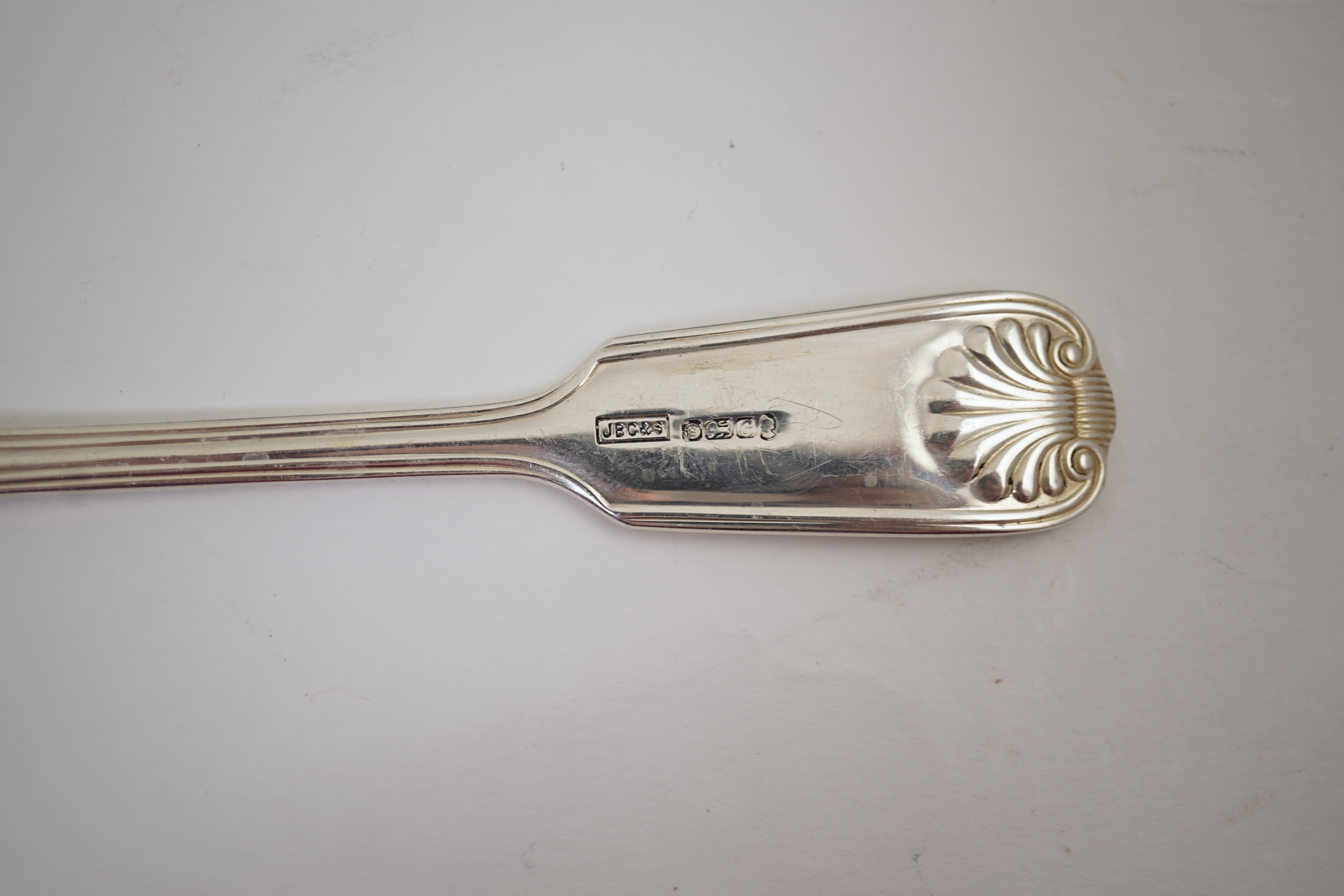 An Elizabeth II part canteen of silver fiddle, thread and shell pattern cutlery, by J B Chatterley & Sons Ltd
